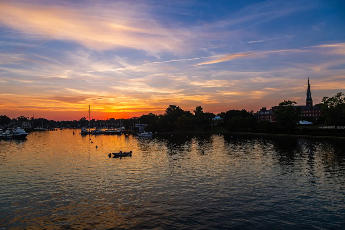 Sunset over the water at Annapolis with boats and a low skyline