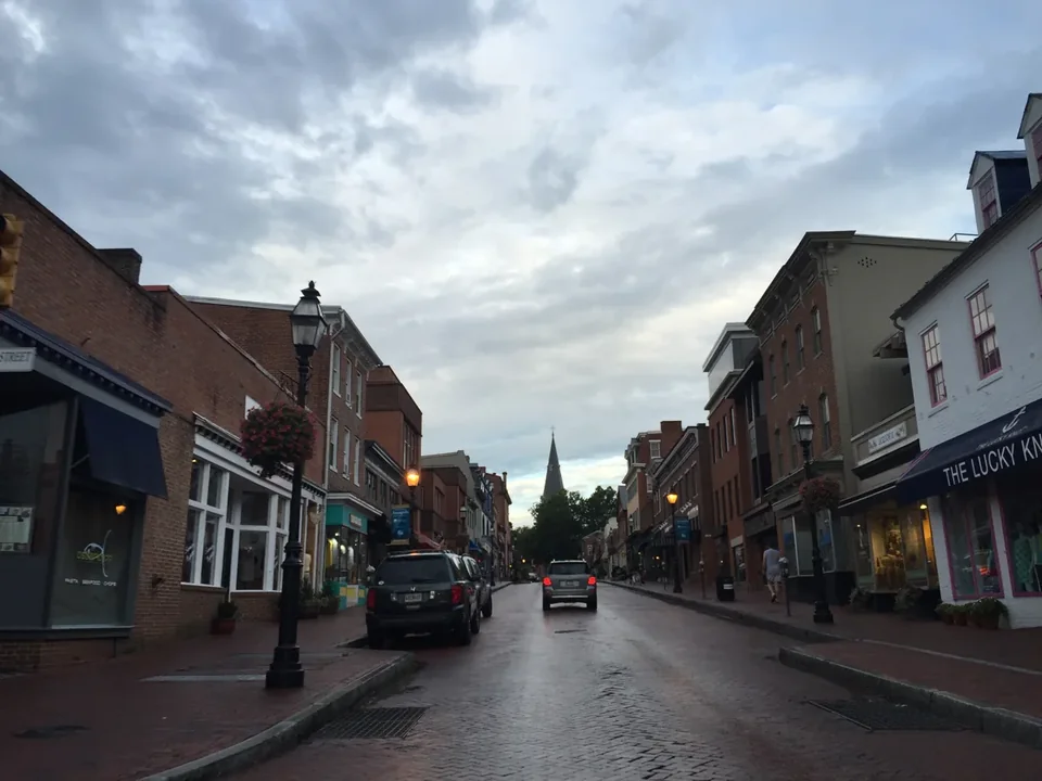Main Street in Annapolis, a brick street lined with old storefronts running downhill