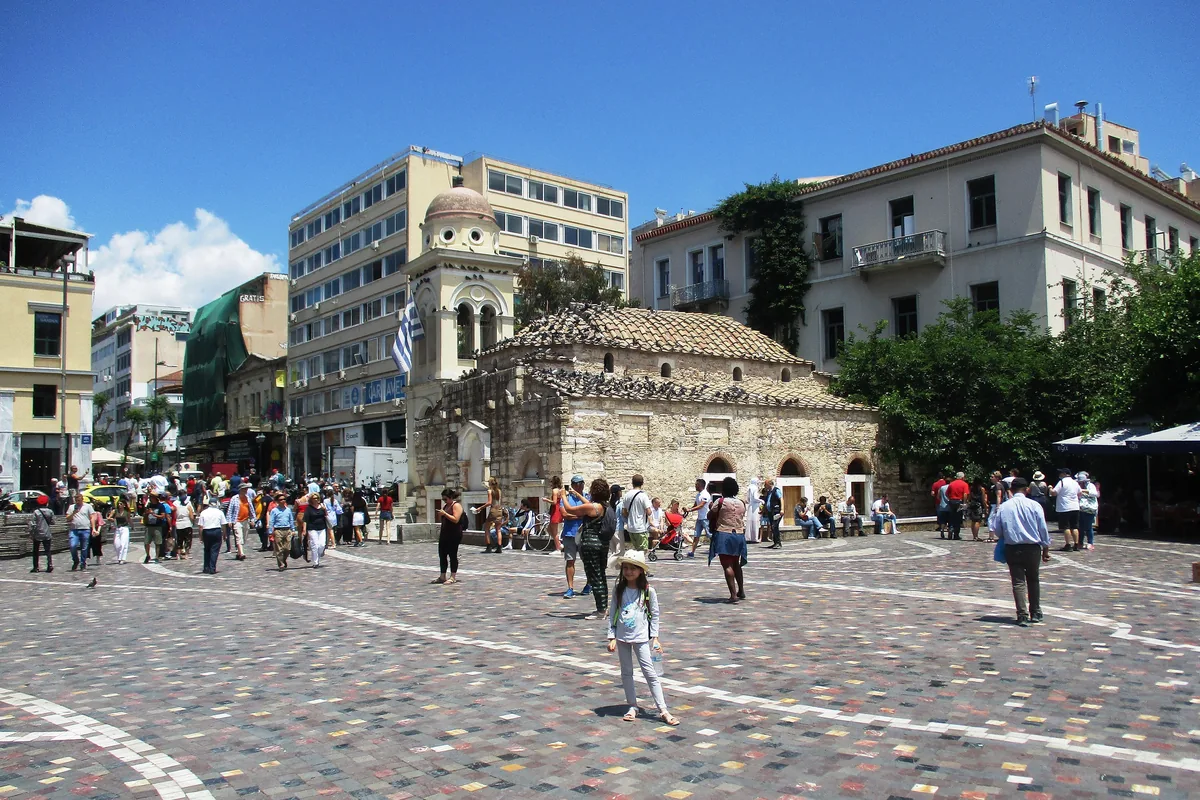 Monastiraki Square with its small church and the metro entrance among walkers