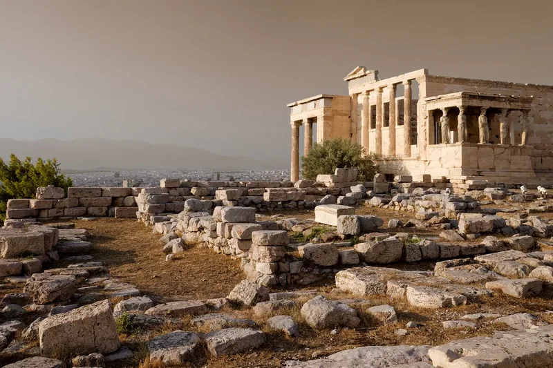 The Erechtheion with its porch of Caryatids above the rocky Acropolis plateau