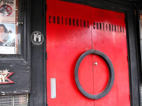 The front door and neon sign of the Continental Club on South Congress