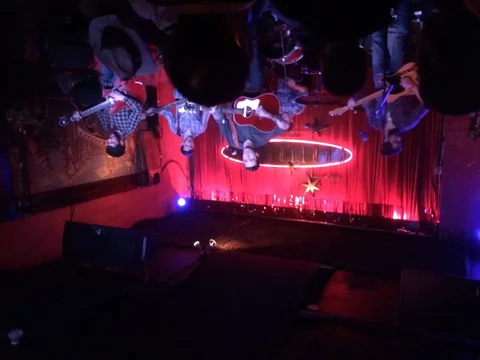 A band performing on the stage of the Continental Club in Austin
