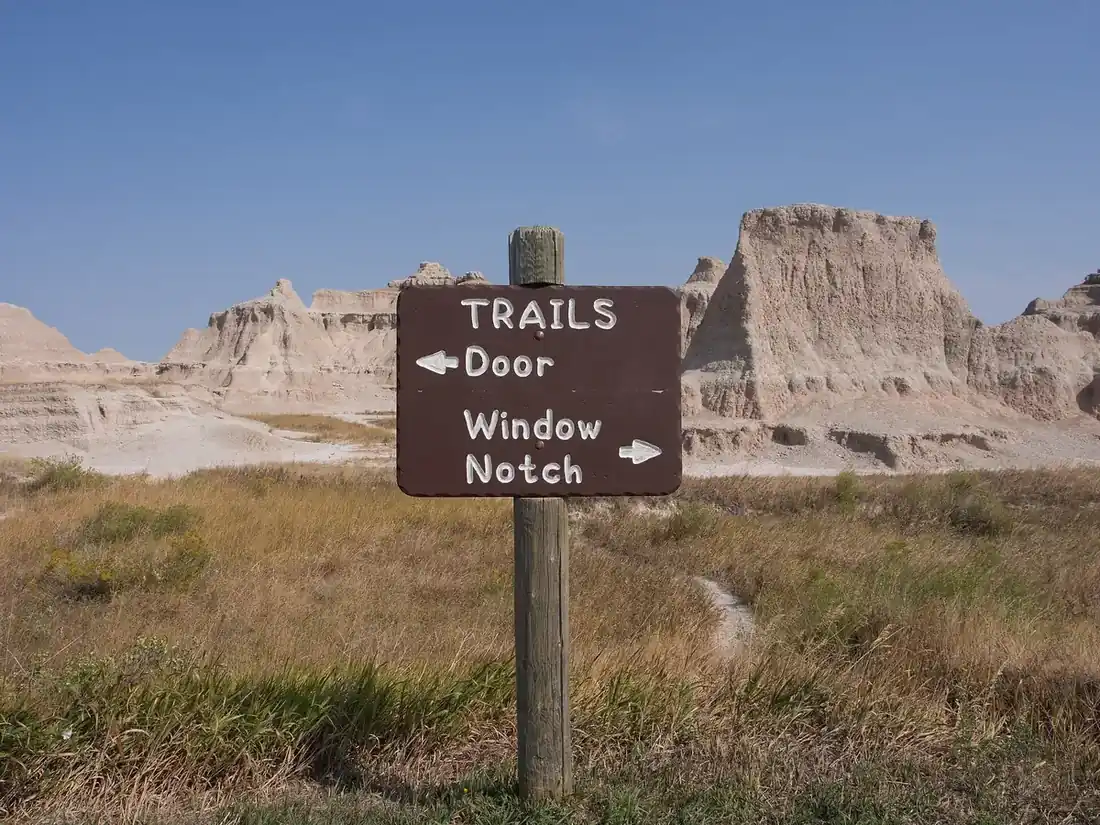 Trailhead signs for the Door, Window, and Notch trails