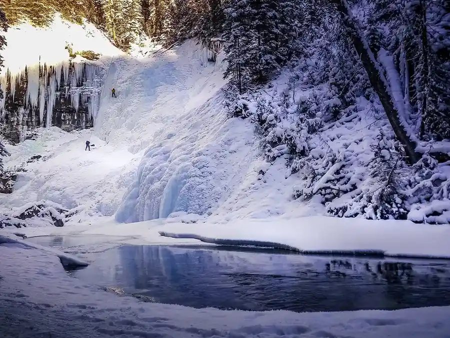 Ice climbers on the frozen Upper Falls at Johnston Canyon