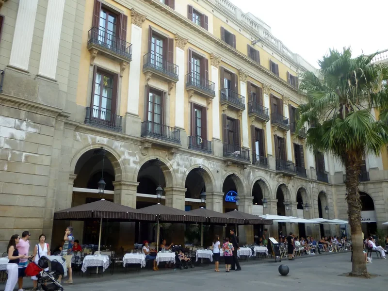 Plaça Reial in Barcelona with palm trees and arcades
