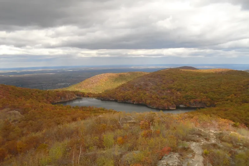 The Beacon Reservoir among autumn hills seen from the south peak of Mount Beacon