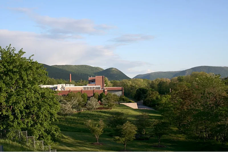 Lawns and trees at Dia Beacon with the hills across the Hudson behind