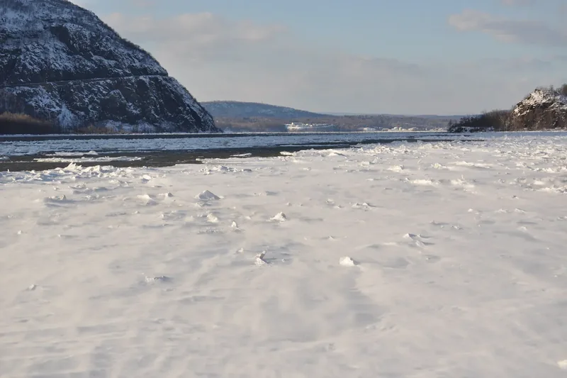 Snow and ice covering the Hudson River shore at Cold Spring in winter