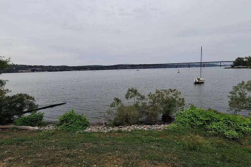 The Hudson River and a sailboat seen from Long Dock Park in Beacon