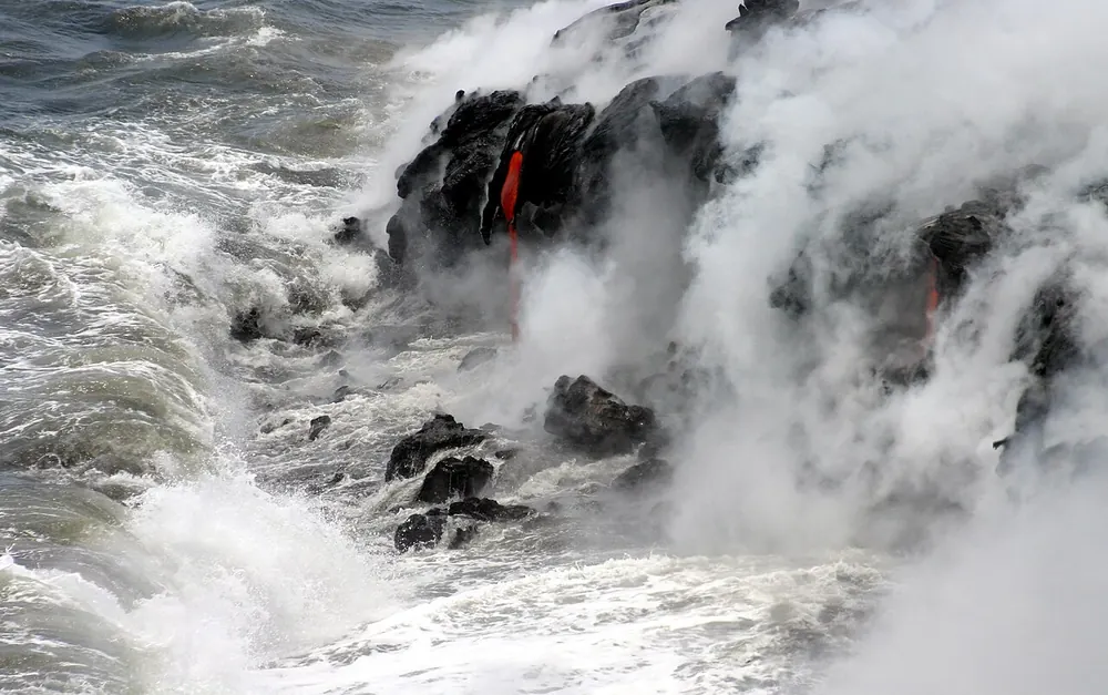 Pahoehoe lava meeting the Pacific Ocean