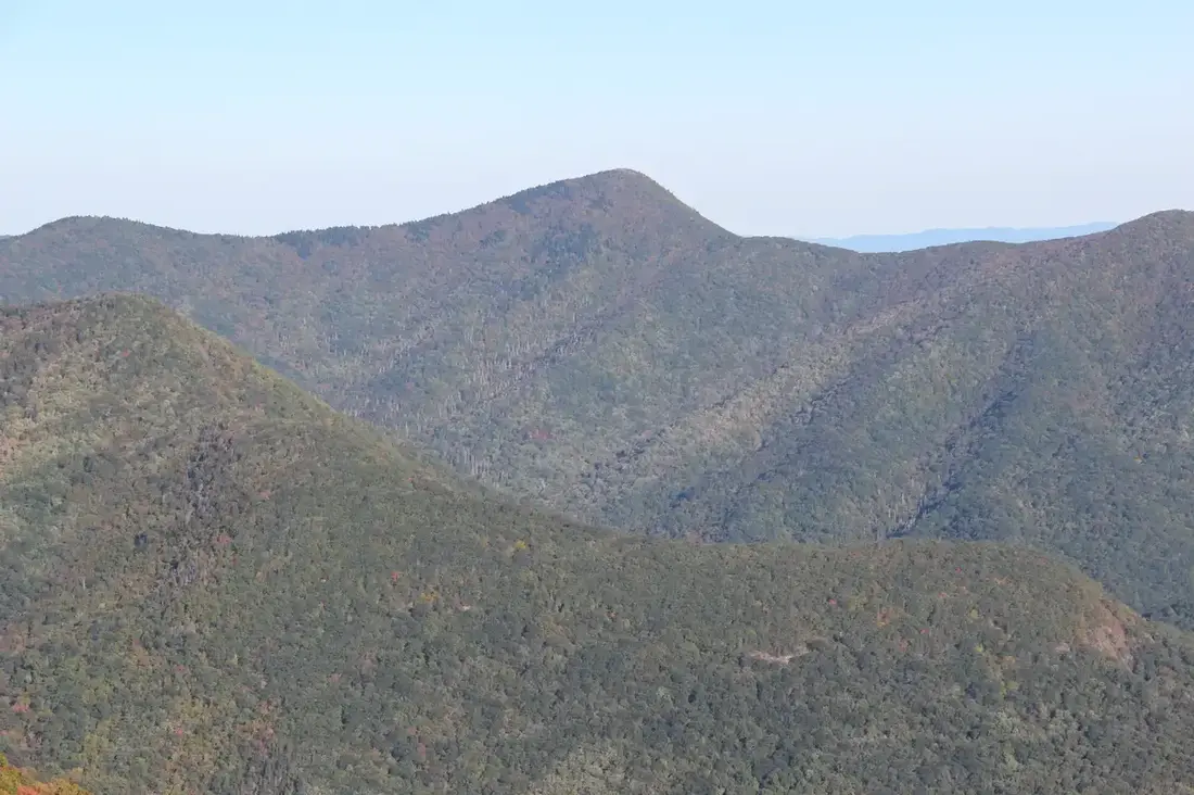 Blue Ridge Pinnacle seen from Graybeard Mountain Overlook in October, layers of ridges fading blue
