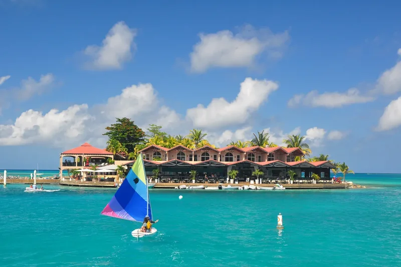 Saba Rock, a small islet with buildings and boats in the North Sound of Virgin Gorda