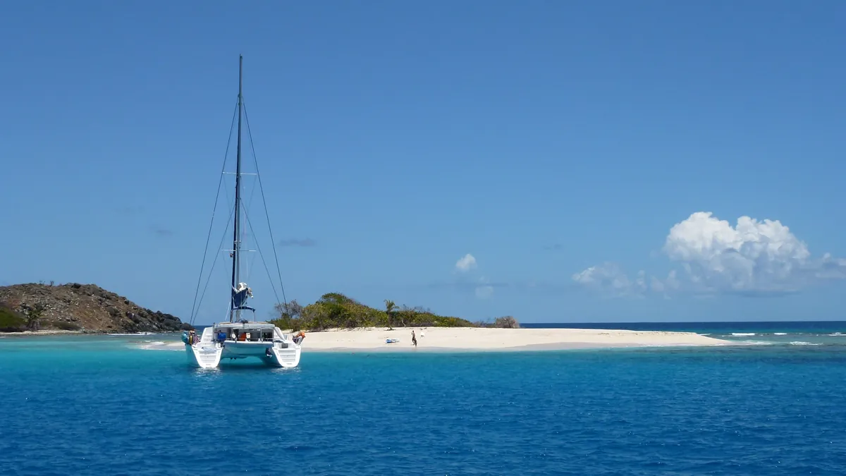 Boats at anchor off Sandy Spit, a tiny white-sand islet in the British Virgin Islands