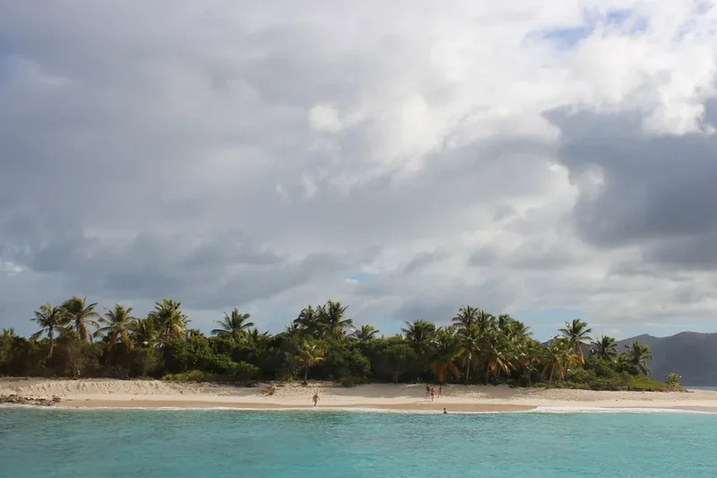 Sandy Cay, a small island of white sand and palms ringed by turquoise water