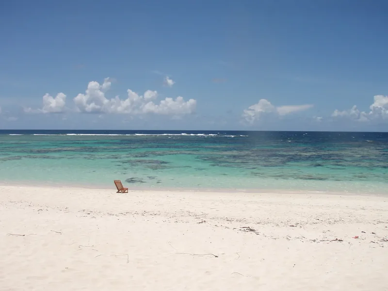 A shallow salt pond with scrub on Anegada