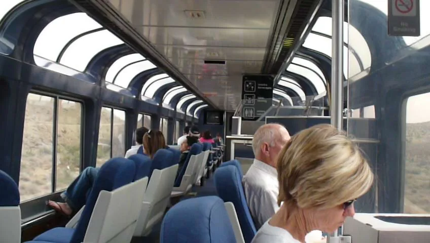 Inside the Amtrak Sightseer Lounge with panoramic windows curving into the ceiling