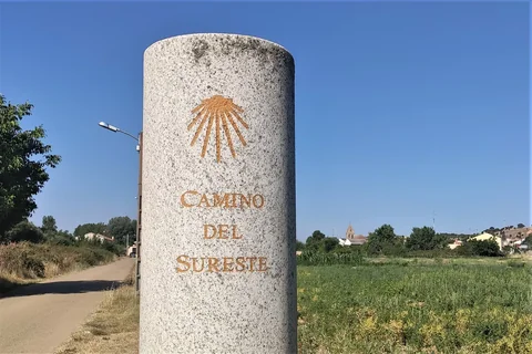 A granite Camino waymark with a scallop shell in Galicia