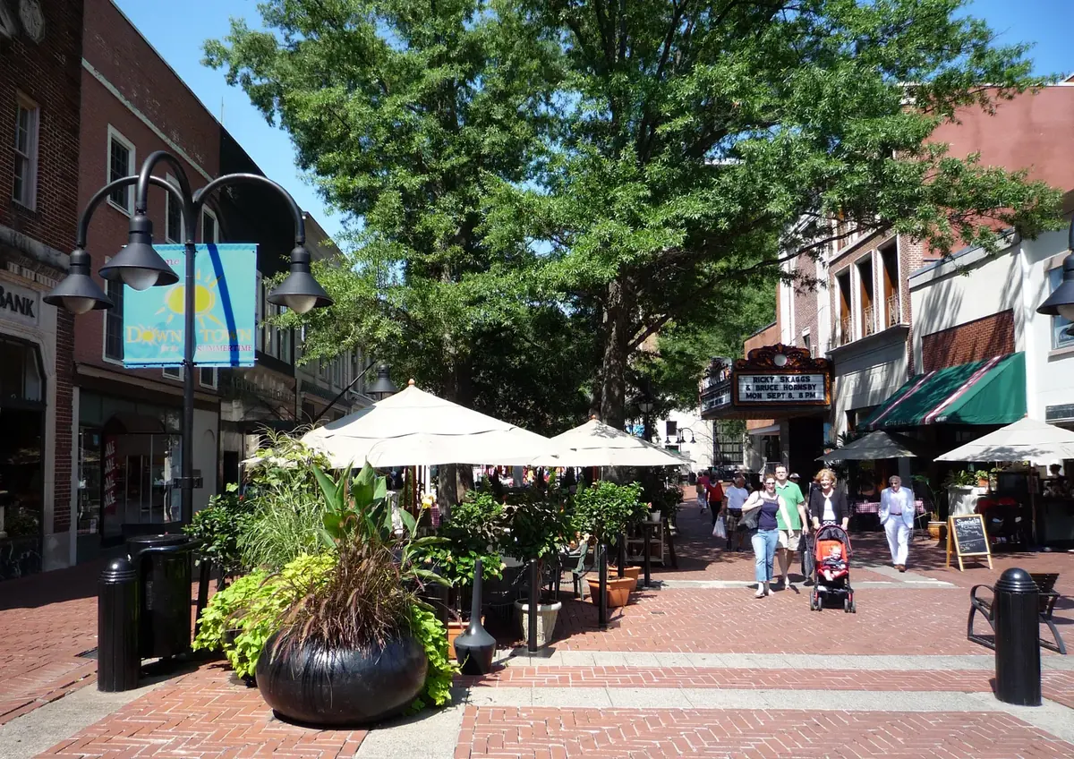Brick paving, trees and café tables on the car-free Downtown Mall in Charlottesville