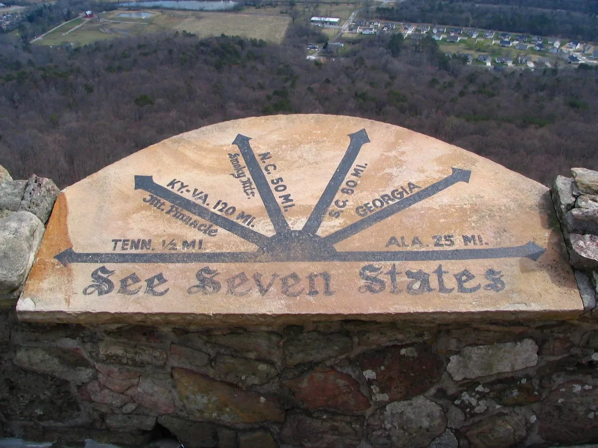 The See Seven States stone at Rock City, its arrows pointing toward neighboring states across the valley