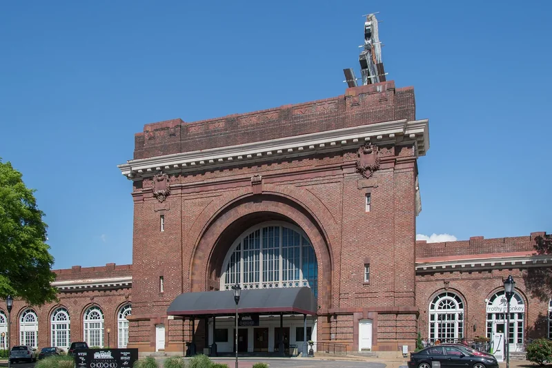 The red-brick arched facade of the former Terminal Station, now the Chattanooga Choo Choo hotel, under a blue sky