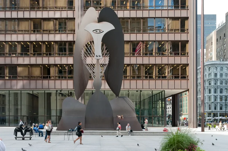 The rust-colored Picasso sculpture in Daley Plaza with the Daley Center behind it