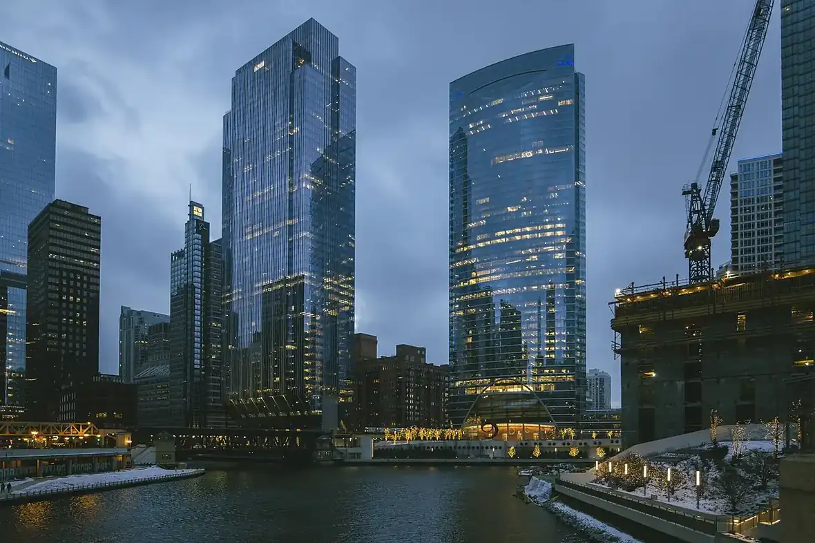 Chicago's skyline at dusk, glowing across the water