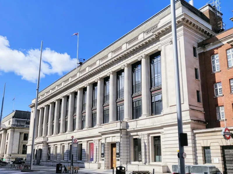 The stone front of the Science Museum on Exhibition Road under a blue sky