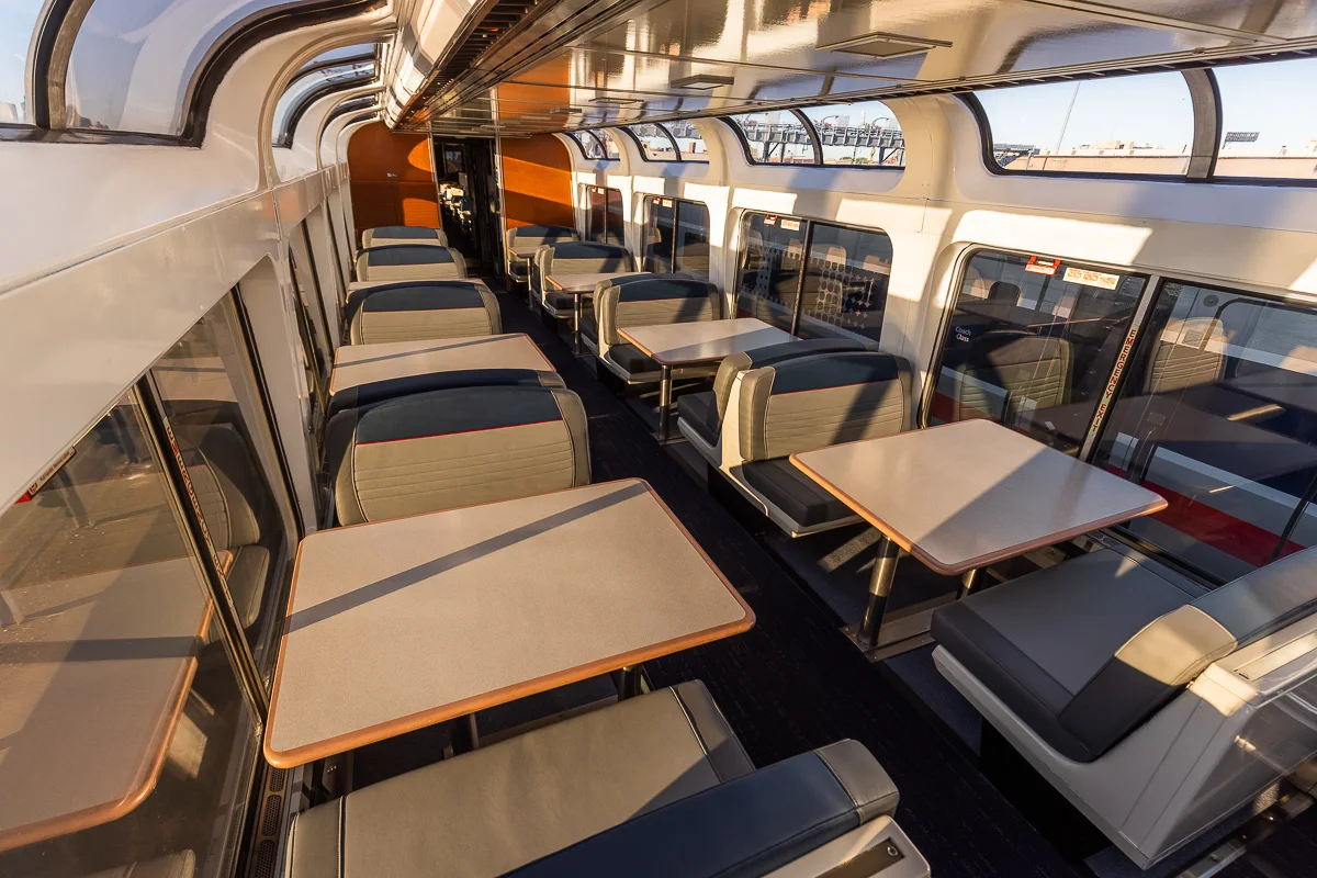 Inside an Amtrak Sightseer Lounge with panoramic windows