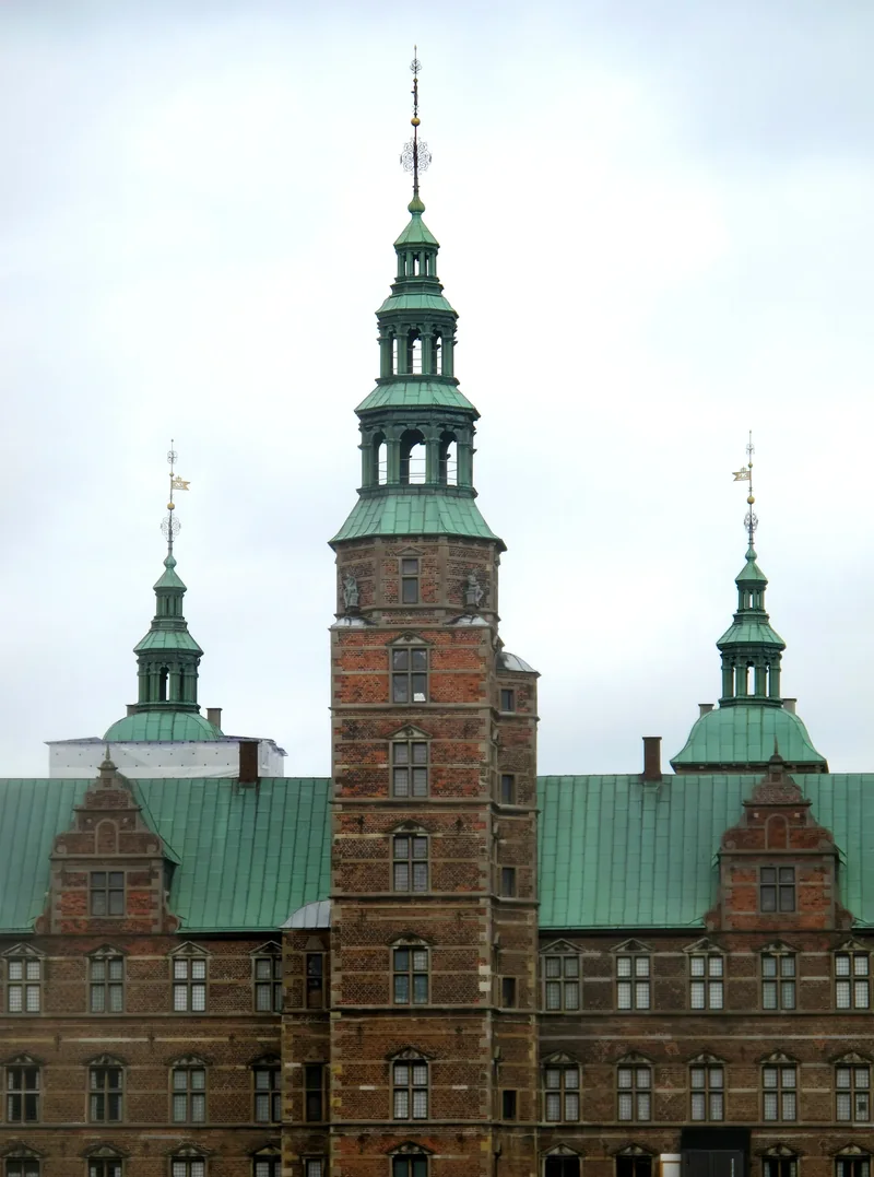 Rosenborg Castle with its red brick and copper spires, seen from the King’s Garden