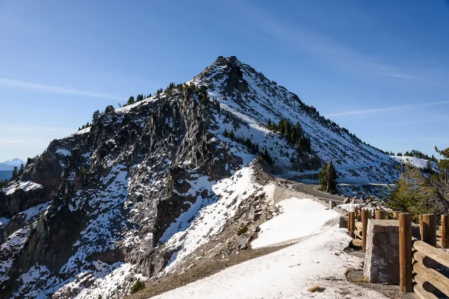 The Crater Lake rim with hikers at an overlook