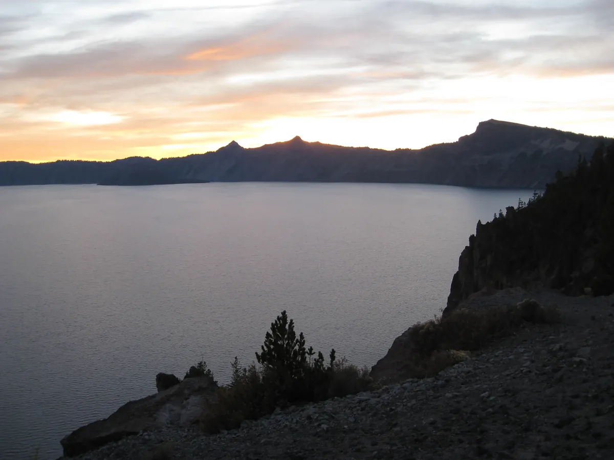 Bright sun over Crater Lake's blue water