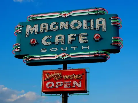 The neon sign of the Magnolia Cafe on South Congress Avenue