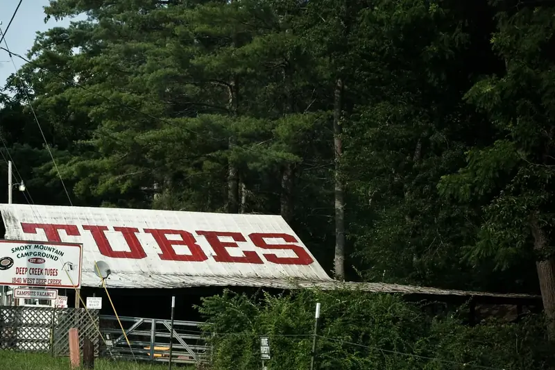 A tube-rental sign by the road in the Deep Creek area near Bryson City