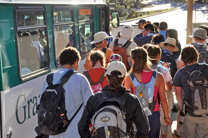 Visitors boarding the Hermit Road shuttle bus at Grand Canyon