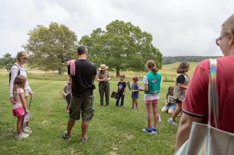Kids and a ranger outdoors at a Shenandoah Junior Ranger program