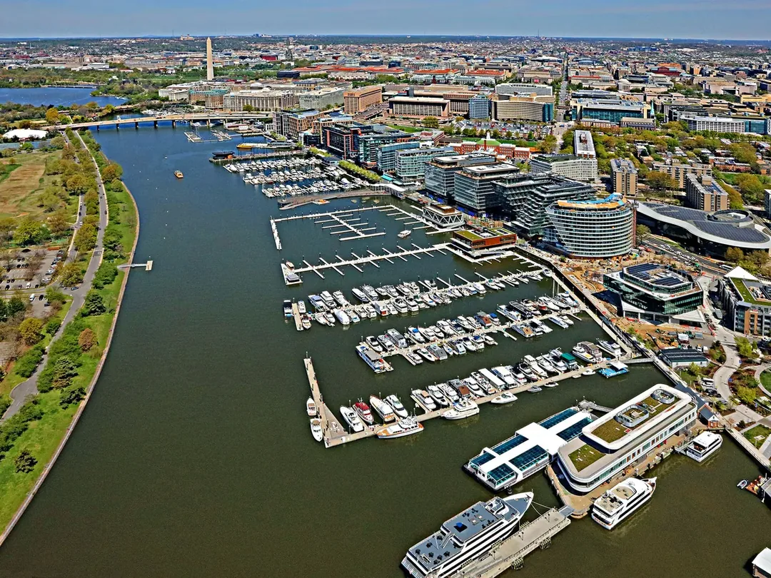 An aerial view of The Wharf on the Washington Channel in Southwest DC, with piers and buildings along the water