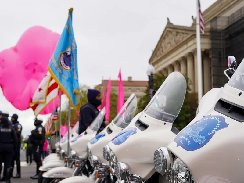 A large balloon and marchers in the National Cherry Blossom Festival Parade in Washington, DC