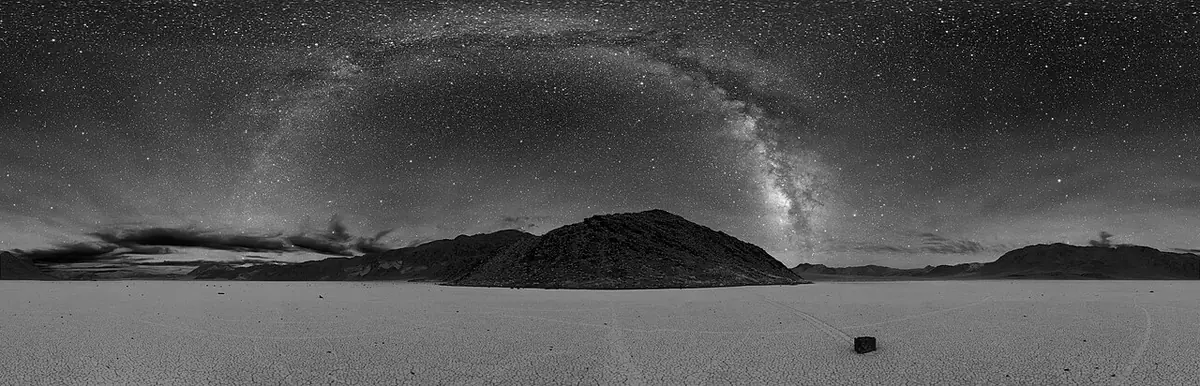 Racetrack Playa at night with the Milky Way over a sailing stone
