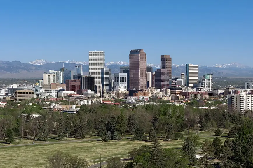 Denver skyline with the snow-capped Front Range behind it