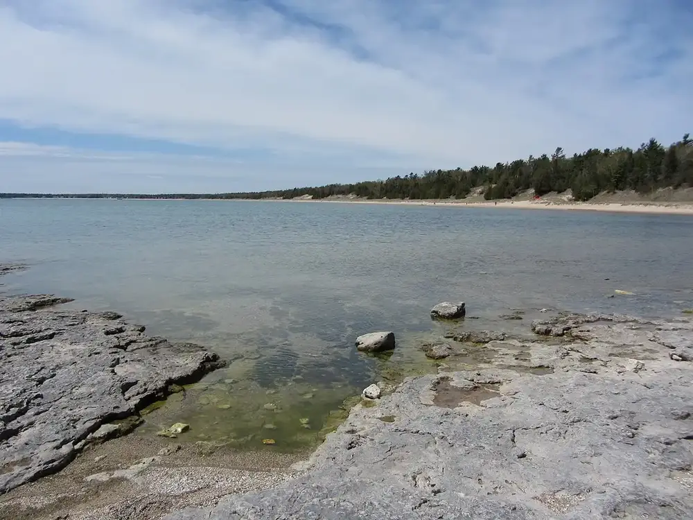 Rocky limestone shoreline at Whitefish Dunes State Park