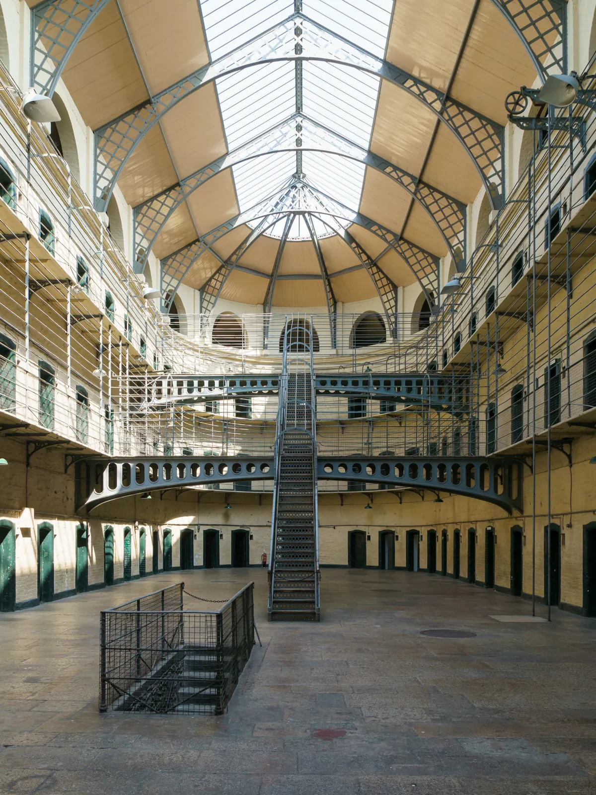 The three-tier main hall of Kilmainham Gaol's East Wing under its skylight