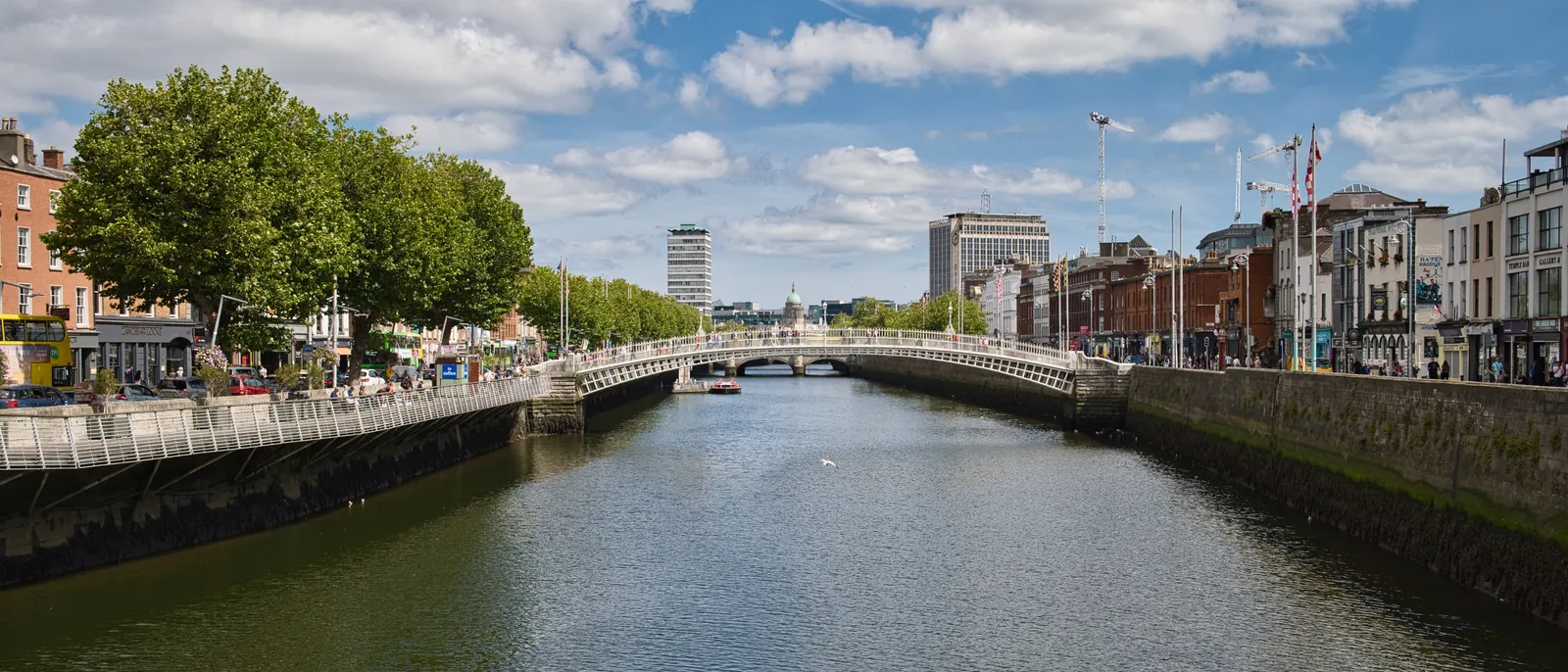 The Ha'penny Bridge over the River Liffey, seen from the Millennium Bridge on a sunny afternoon