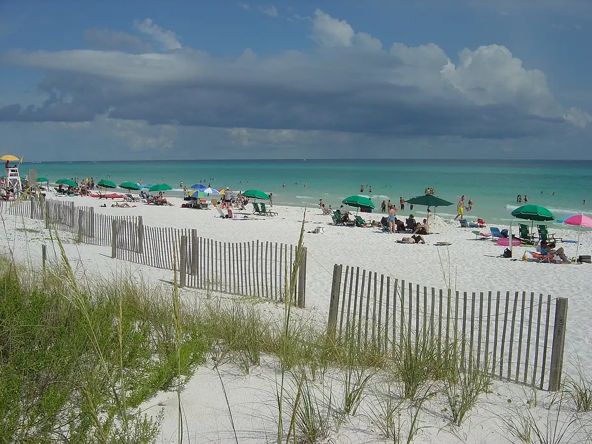 Emerald water and white sand with beach umbrellas on Okaloosa Island
