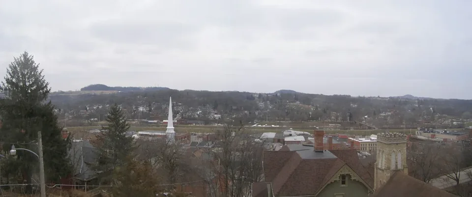 The Galena River valley seen from the bluffs, a church steeple among bare trees and hills