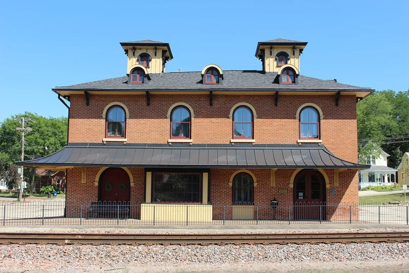 The former Illinois Central depot in Galena, a long brick station with two cupolas beside the tracks