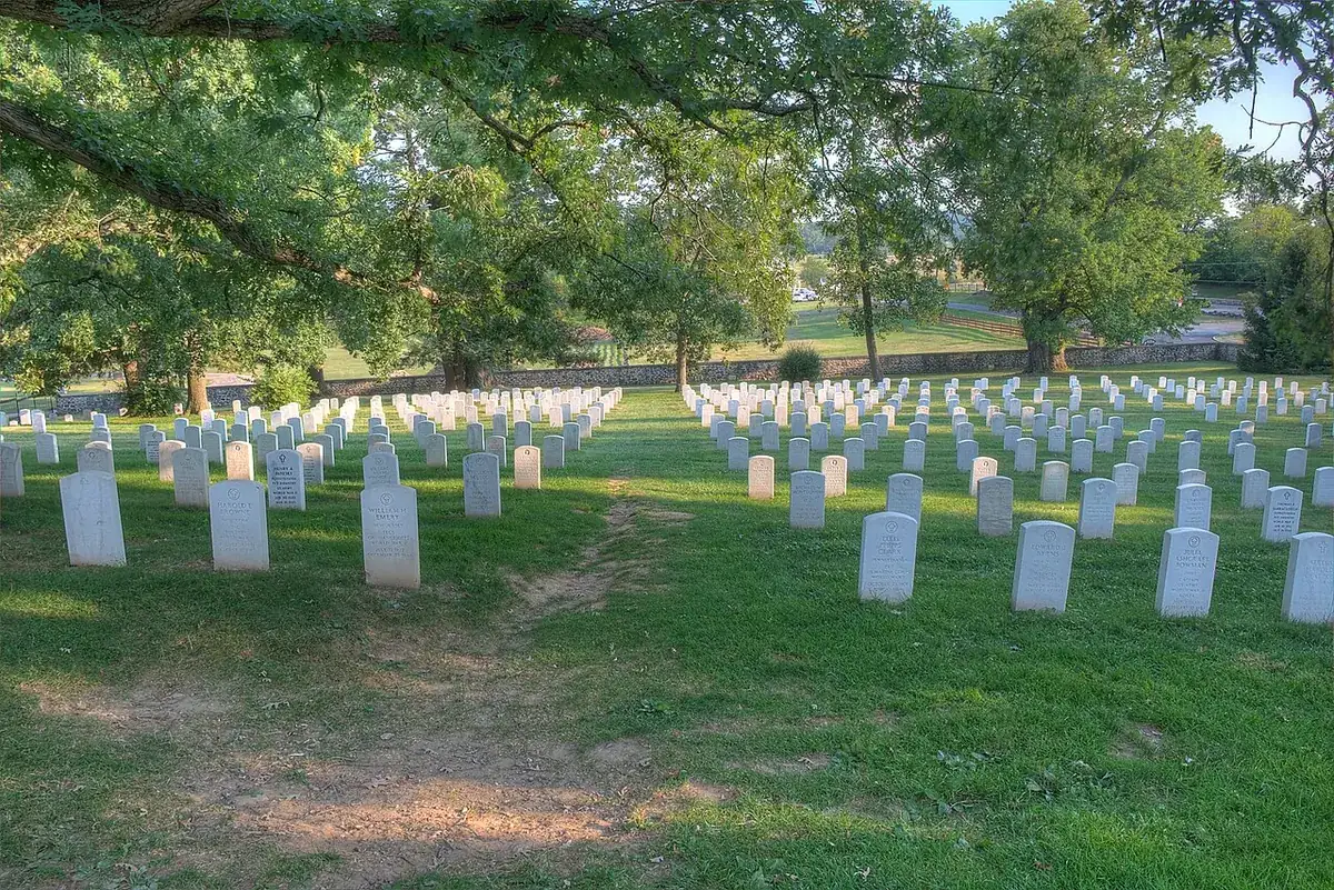 Rows of headstones in the Soldiers' National Cemetery at golden hour