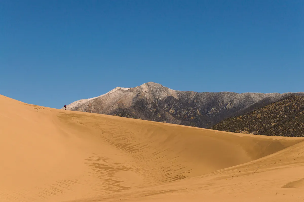 Hikers on a dune ridge at Great Sand Dunes