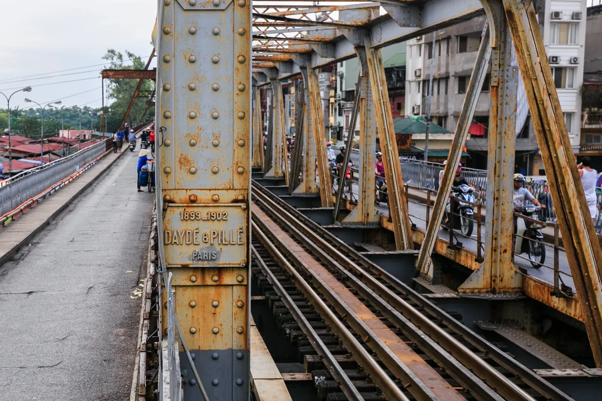 The long steel spans of Long Bien Bridge over the Red River in Hanoi