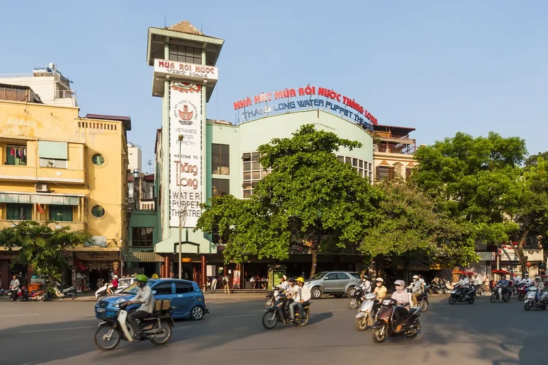The Thang Long Water Puppet Theatre building on a street by Hoan Kiem Lake