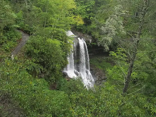 Dry Falls waterfall cascading through lush forest near Highlands, NC